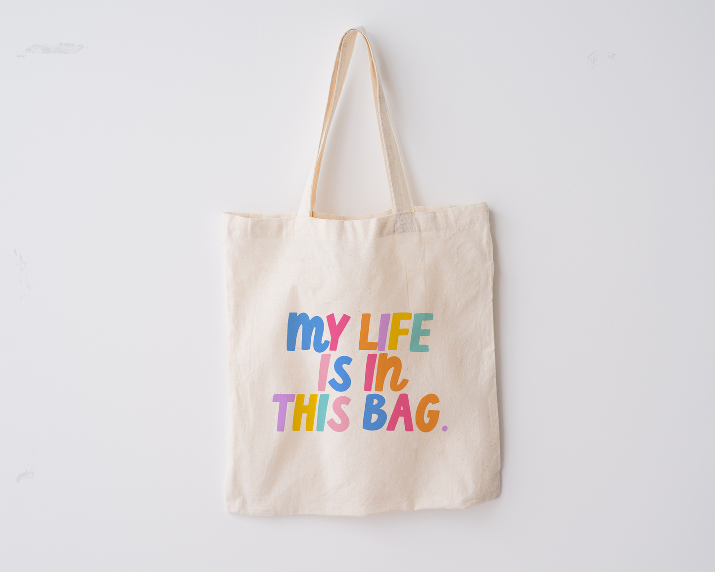 Fun Tote bag including the phrase 'my life is in this bag' in colorful block lettering