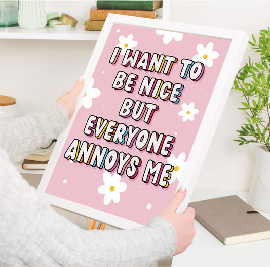 Colorful wall art print with the quote "I Want to Be Nice but Everyone Annoys Me" against a vibrant background.