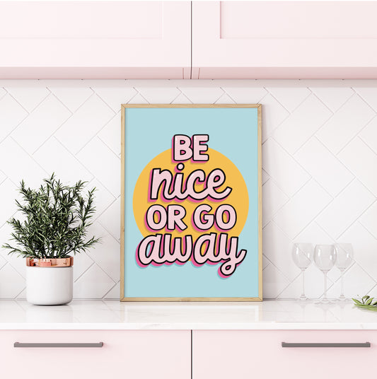 Colorful wall art print with the quote "Be Nice or Go Away" against a vibrant background.