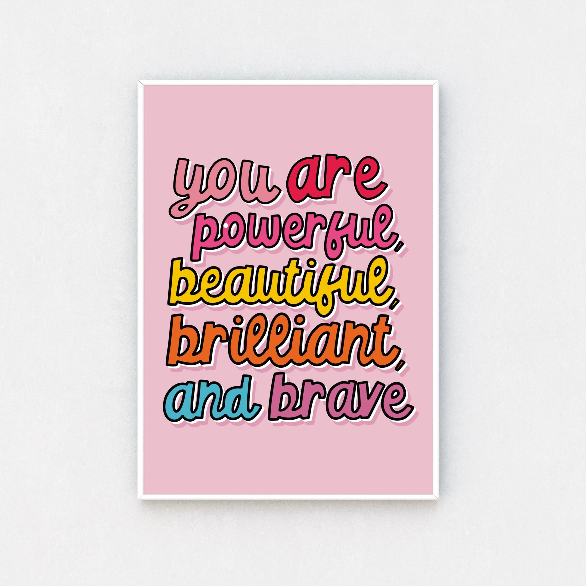 "Vibrant Framed Artwork - 'Powerfully Pink' Print displayed in a white frame, adding a pop of motivation to any space. Sizes range from A5 to A3. Free UK delivery available."
