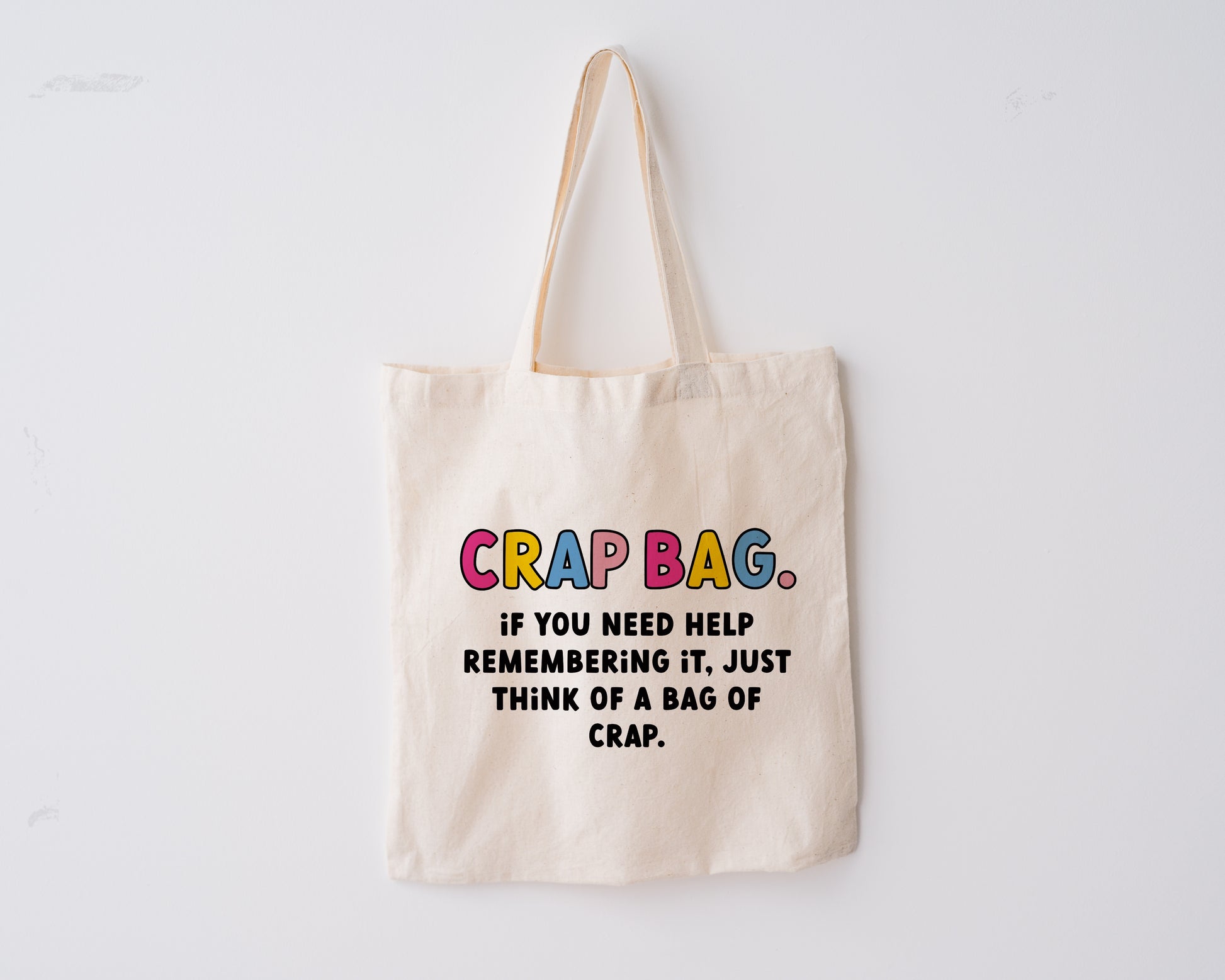 Colourful Tote bag with the quote "crap bag. If you need help remembering it, just think of a bag of crap." from the TV show 'Friends'