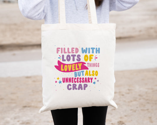 Bright Natural Coloured Tote Bag, with the quote "Filled with Lots of Lovely Things but Also Unnecessary Crap" in pink, purple, blue and yellow writing