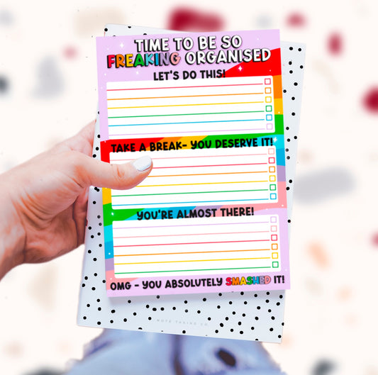  'Time to Be So Freaking Organised' Notepad: A dynamic product image featuring the quote "time to be so freaking organised." Designed by Colourful Life, A5 size, tear-off sheets, and a sturdy cardboard backing for a burst of vibrant organisation.
