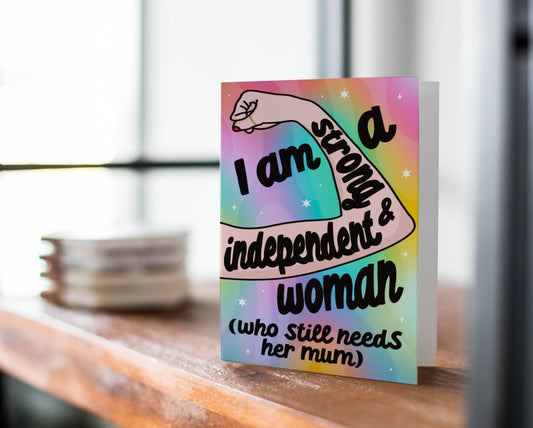 'Strong & Independent' Greeting Card Front: A vibrant image featuring the quote "I am a Strong & Independent Woman (Who Still Needs Her Mum)." Designed by Colourful Life, 5x7 inch size, with a smooth silk finish.