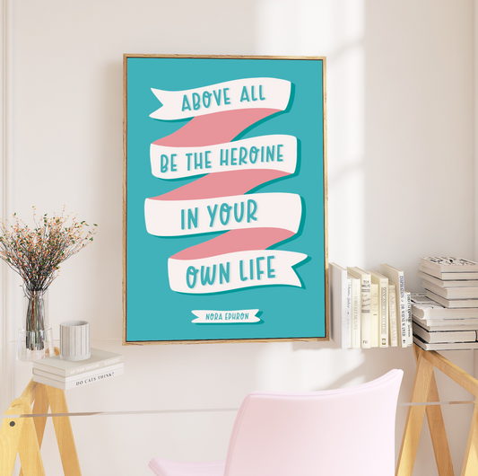 "Framed 'Be Your Own Heroine' Print - Vibrant quote by Nora Ephron, 'Above all be the heroine in your own life,' framed in bold black. Available in sizes A5 to A3. Free UK delivery."