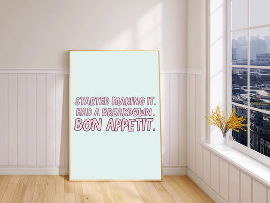 "Framed print: 'Started Making It Had a Breakdown. Bon Appétit' in playful blue and pink."